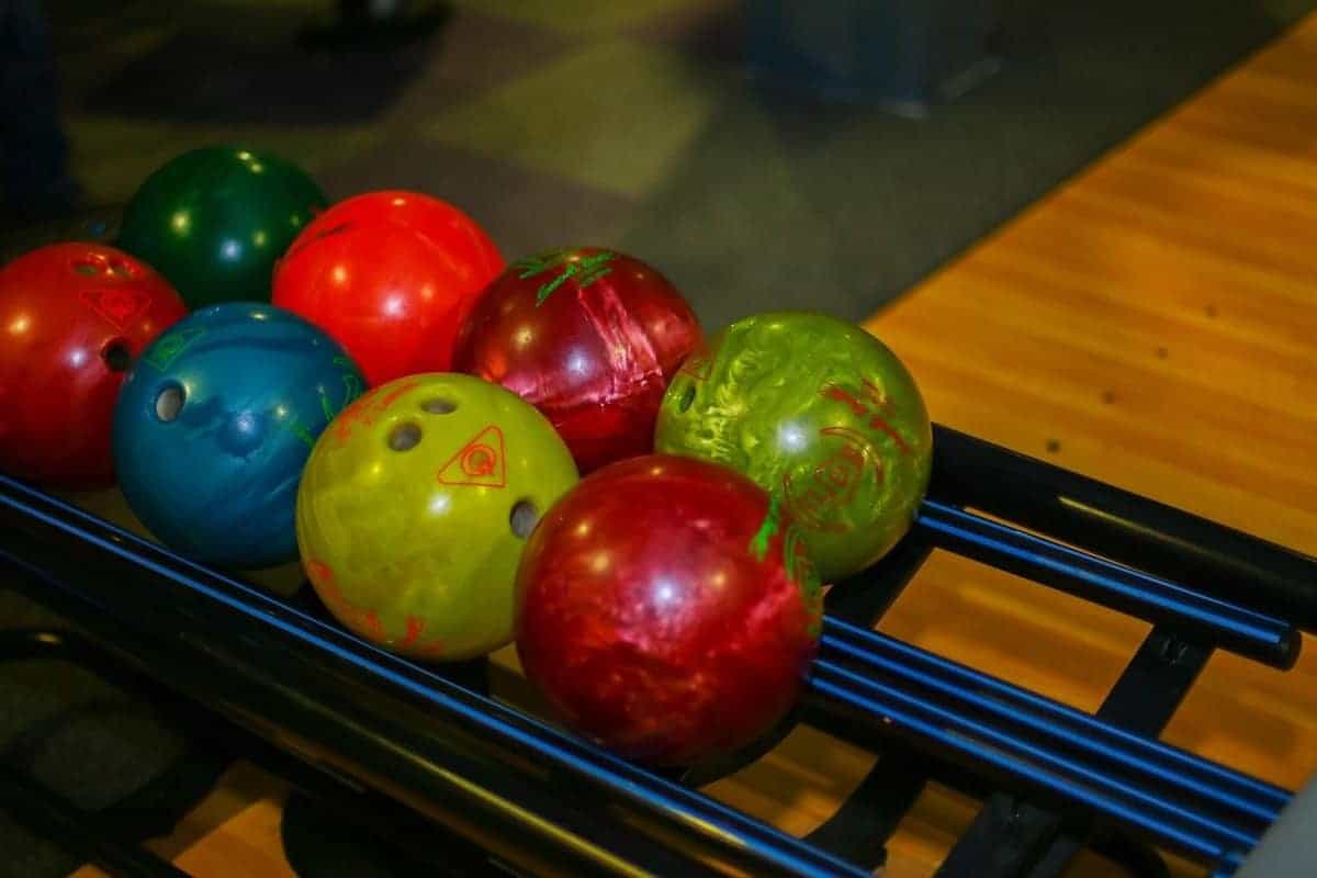 Bowling balls on return rack