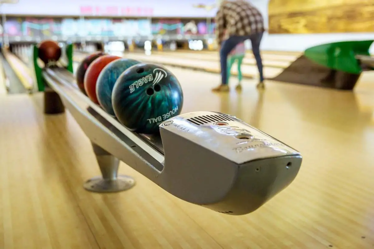 Photo of bowling ball return rack from score table