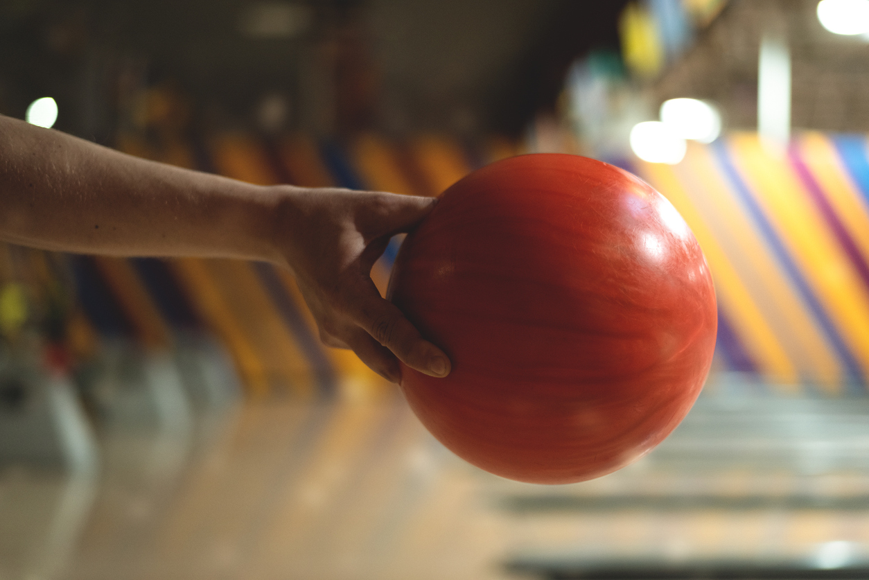 Close up of hand holding bowling ball