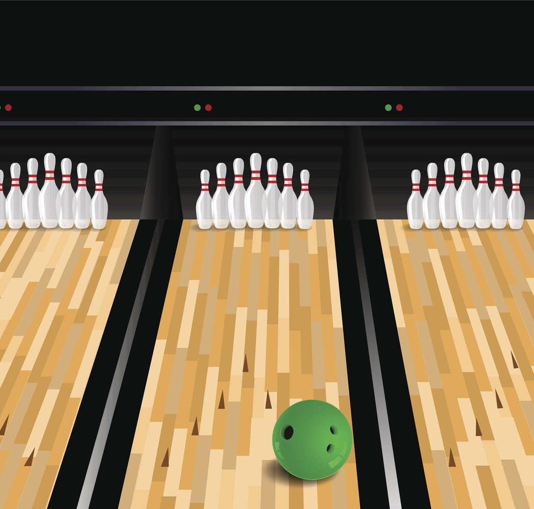 Green bowling ball in mid bowling lane drifting to right